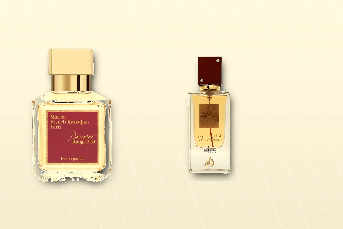 Crystal MFK-style bottle beside a smaller red-label inspired-by bottle on marble, BR540 dupe comparison still life