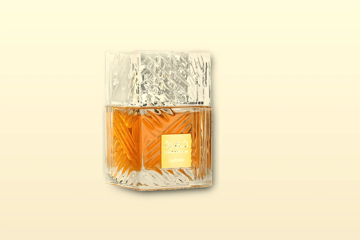Single amber-glass bottle on a linen cloth, ultra-budget fragrance still life